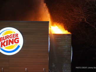 One hand line stream just after fire breaks through the roof at extra alarm fire at Burger King on Rand Road in Lake Zurich (PHOTO CREDIT: Jimmy Bolf).