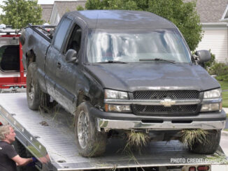 Offender's Chevrolet Silverado on a flatbed tow truck after he was captured in the Grand Dominion by Del Webb community following a pursuit that started in Wauconda (SOURCE: Craig/CapturedNews)